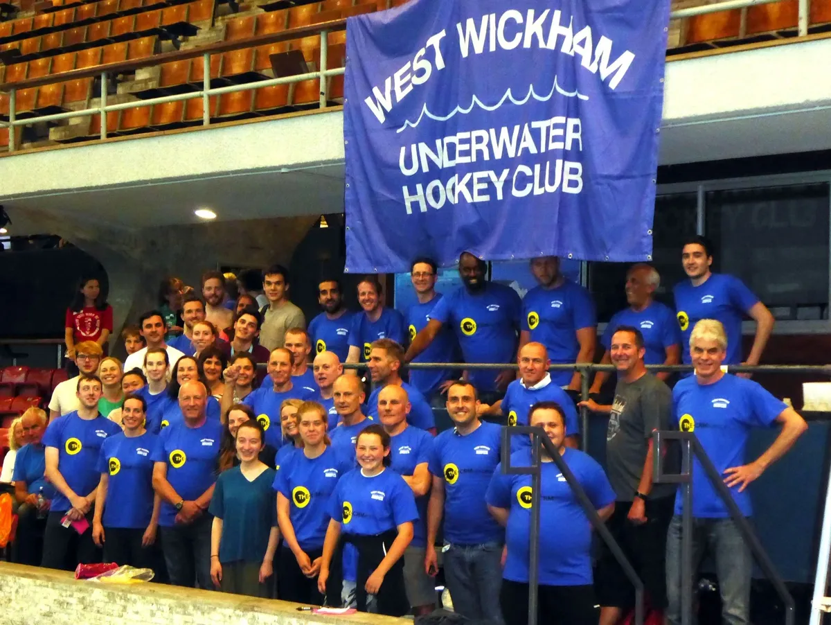 Swimmers lined up at poolside ready for the charity swim event