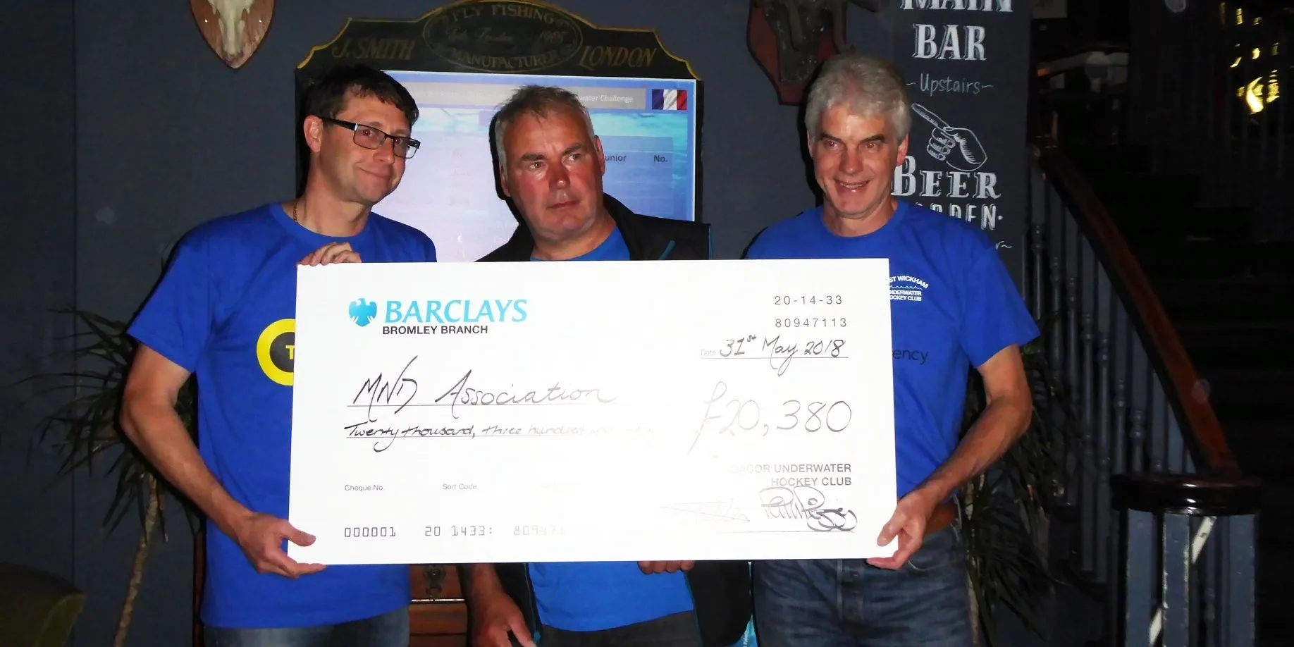 West Wickham UWH club members gathered poolside during the Channel Swim for MNDA charity event